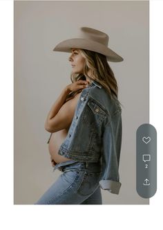 a pregnant woman wearing a cowboy hat and jeans is posing for the camera with her hands on her hips