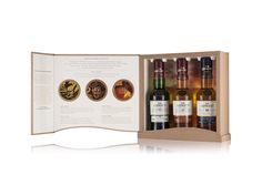 an open wine box with three bottles in it