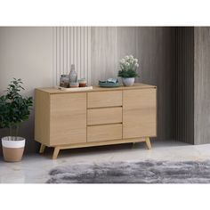 a sideboard with two vases on it and a potted plant next to it