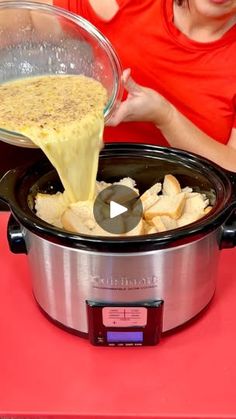 a woman pouring batter into an electric slow cooker filled with potatoes and other ingredients