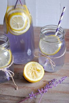 three mason jars filled with lemonade and lavender water