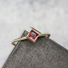 Delicate Kite Set Anthill Garnet 18K Yellow Gold Ring Rose Pink Wine Princess Cut Arizona Gemstone Modern Elegant Square Setting - Roseneck by NangijalaJewelry on Etsy Gift Pink Sapphire Ring With Rose Cut Diamonds, Pink Sapphire Ring With Rose Cut Diamonds As Gift, Pink Ruby Ring For Proposal In Fine Jewelry Style, Fine Jewelry Pink Ruby Ring For Proposal, Elegant Yellow Gold Tourmaline Birthstone Ring, Elegant Pink Ruby Gemstone Ring, Pink Ruby Ring For Proposal, Elegant Pink Ruby Ring, Elegant Ruby Birthstone Ring With Tourmaline