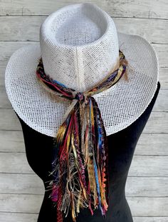 This vibrant hat band will add a festive splash of color to a variety of hats all throughout the year!  This hat band will make quite the statement worn on any color hat!   Made with unique specialty yarn of beautiful colors and textures, each band comes pre knotted to fit the standard size hat of 24" but the back knot can be untied and adjusted if needed.  The tail part of this hat band measures 10 inches.  If a different tail length is desired please just note it on the order. The width of the