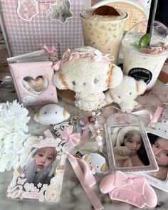 a table topped with pictures and teddy bears