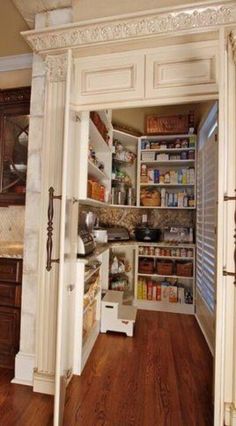 an open pantry with lots of food in it and the door opened to reveal what's inside