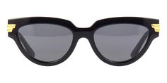 BOTTEGA VENETA BV1035S 001This cat eye Bottega Veneta sunglass comes in a black frame with grey lenses.About Bottega Veneta:Since its establishment in the Veneto region of Italy in 1966, Bottega Veneta has been synonymous with a new standard of luxury. Rooted in the rich traditions of Italian master craftsmen, the brand's ethos revolves around discretion, quality, and unsurpassed craftsmanship. Each piece created by Bottega Veneta's artisans is a testament to their extreme attention to detail, h Classic Black Cat Eye Sunglasses With Uva Protection, Classic Black Cat Eye Sunglasses With Mirrored Lenses, Classic Black Cat Eye Sunglasses, Matte Black Sunglasses With Uv Protection For Evening, Matte Black Cat Eye Sunglasses For Evening, Matte Black Sunglasses With Mirrored Lenses For Evening, Matte Black Polarized Sunglasses, Matte Black Mirrored Sunglasses For Evening, Wayfarer Sunglasses With Uv Protection