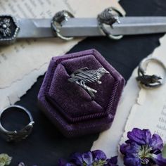 Unleash your inner magic with our Midnight Messenger Rings. These witchy raven rings are adjustable for the perfect fit and add a mystical touch to any outfit. Made entirely out of sterling silver. Dimensions: rings are adjustable and will fit most sizes. Ready to ship! Shipping All orders will come with standard tracking and insurance for peace of mind. It is important to note that I cannot be held responsible for any lost packages or items marked as "Delivered" during transit. While I am happy Raven Rings, Threader Earrings, Huggie Hoop Earrings, Ring Bracelet, Ring Necklace, Shop Necklaces, Jewelry Care, Shop Earrings, Post Earrings