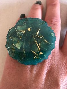 This is an adjustable ring made with epoxi resine, green mica and gold paper. Each piece is unique, handmade fabrication. The resin itself is sealer and water proof but to increase the longevity of the ring band itself the ring should be removed before hand washing and should avoid contact with house hold cleaners. We strive for 100% customer satisfaction. If any problems are encountered upon receipt, please notify me for a quick and friendly resolution. Don't forget to make sure your Etsy addre Big Statement Rings, Ring Resin, Huge Rings, Leather Anniversary Gift, Big Ring, Leather Anniversary, Green Ring, Art Ring, Golden Green