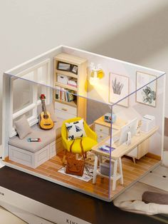 a doll house with furniture and accessories in it