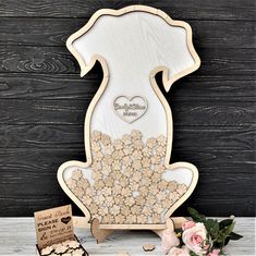 a wooden frame with flowers and hearts on it