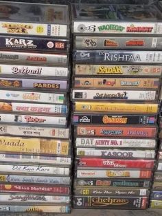 a pile of dvds sitting on top of each other