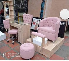 pink chairs and foot stools are on display