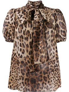 Dolce & Gabbana’s signature use of leopard print is revealed every collection in a number of refreshing, unexpected ways. Pair this chic leopard print pussy bow blouse from D&G's AW19 collection with straight jeans and sandals during the day, then change into a fitted mini skirt and heels ready for a night out. Organza Blouse, Bow Blouse, Leopard Print Blouse, Dolce E Gabbana, Dolce & Gabbana, Straight Jeans, Mini Skirt, Leopard Print, Animal Print