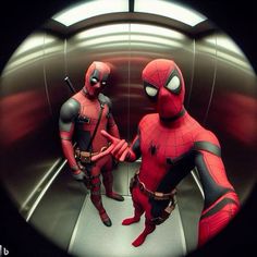 two people dressed as deadpool and spider - man are standing in a metal room