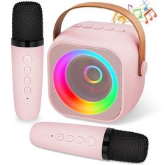 two microphones and a speaker with colorful lights