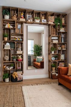 a living room filled with lots of furniture and bookshelves covered in wooden crates