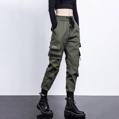 Our new Military Techwear Pants are the perfect addition to your wardrobe. Combining function with fashion, these pants are made with a comfortable fit and a stylish design. The perfect choice for the modern woman, these pants are ideal for both everyday wear and workouts.Featuring a lightweight, breathable fabric, our Military Techwear Pants are perfect for any activity. The high-waisted design provides full coverage and support, while the form-fitting silhouette flatters your figure. The taper Techwear Outfits Women, Unique Clothing Stores, Steampunk Pants, Hip Hop Cargo Pants, Red Parka, Techwear Streetwear, Techwear Pants, Cargo Pants Black, Techwear Outfits