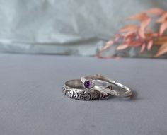 Dainty Amethyst Ring, Botanical Ring Set, Gifts for Sister, February Birthstone A lovely set of two sterling silver rings with an antique feel.  One sterling silver band ring with flower and leaf pattern and a skinny twig ring featuring a 3mm amethyst cabochon. The band of the wider ring is 2mm wide. The price is for both rings. All my items are custom made so please allow at least two weeks before shipment and bear in mind that the item you receive might have slight differences with the one pic Elegant Amethyst Stackable Rings As Gift, Heirloom Style White Gold Amethyst Ring Gift, Heirloom White Gold Amethyst Ring As Gift, Heirloom Style Amethyst Ring In White Gold, Heirloom Amethyst Ring In White Gold For Gift, Nature-inspired Purple Sterling Silver Jewelry, Delicate Amethyst Ring As Gift, Dainty Handmade Silver Birthstone Ring, Delicate Amethyst Ring For Anniversary