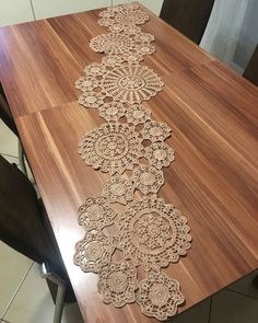 a wooden table with lace on it