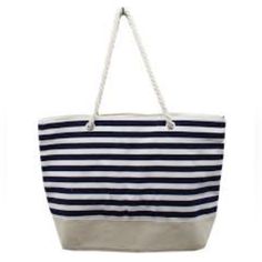 Nwot Lancome Beach Boat Bag. This Bag Has A Black And White Horizontal Striped Top With A Champagne-Colored Bottom. The Bag Is 15" High - 11 1/8" Is Striped. The Bottom Is Soft Vinyl And Is 19 1/$' Across And 4 1/8' Wide. The Top Is Canvas. There Are Large Rope Straps On Each Side That Go Thru Loops In The Bag And Are Knotted. The Bag Snaps And There Is One Open Pocket Inside. Casual Canvas Vacation Bag, Casual Canvas Shoulder Bag For Vacation, Striped Travel Bags For Summer, Casual Canvas Bag For Vacation, Striped Travel Bags For Beach Season, Striped Tote Bag For Vacation, Striped Summer Bags For Daily Use, Striped Beach Bag For Travel, Striped Rectangular Vacation Bag