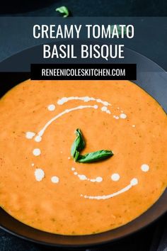 a bowl of creamy tomato basil bisque on a black plate with the title above it