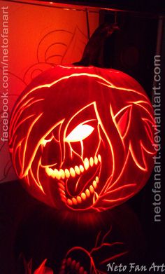 a pumpkin carved to look like a lion head with glowing eyes and fangs on it's face