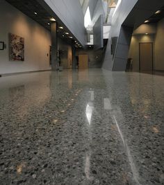 the inside of an office building with shiny floors