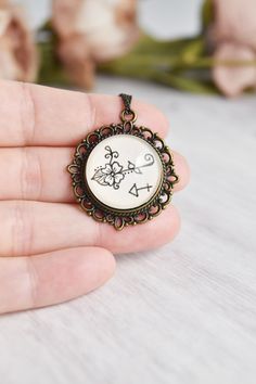 Your zodiac witchy necklace collection is not complete without a Sagittarius necklace arrow sign. Handmade with whimsical, cute miniature art and a vintage style, this Sagittarius pendant ignites your inner magic. The Sagittarius jewelry is painted by hand, making each piece unique and one of a kind, just like you. Click through to see more glass pendant necklaces!