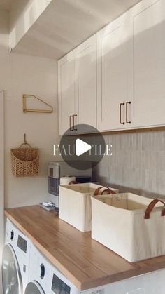 a washer and dryer sitting on top of a wooden counter in a kitchen