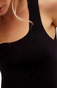 Love to layer in this staple square-neck bodysuit punctuated with a cheeky back. Snap closure Built-in shelf bra Square neck Sleeveless 60% lyocell, 35% polyamide, 5% elastane Machine wash, line dry Imported Chic Seamless Camisole Bodysuit, Chic Stretch Bodysuit Bra Friendly, Tank Bodysuit With Built-in Bra, Sleek Sleeveless Stretch Crop Top, Chic Seamless Cami Bodysuit, Chic Seamless Bodysuit With Tank Straps, Seamless Scoop Neck Crop Top For Night Out, Trendy Tank Bodysuit Seamless, Trendy Seamless Tank Bodysuit