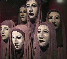 several masks are lined up in a row