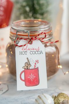 a jar filled with hot cocoa sitting on top of a table