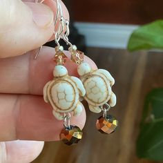 Cute carved and detailed turtles with a bronze crystal dangle. Great with your tropical outfits! Tropical Outfits, Marble Falls, Cute Turtle, Turtle Charm, Turtle Earrings, Cute Turtles, Earring Ideas, Wood Jewellery, Charm Earrings