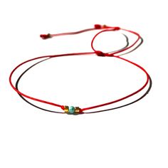 "Turquoise guardian stone bracelet a tiny 2mm turquoise stone with 1mm golden glass beads on vibrant thin red string bracelet, waterproof If you are looking for a super minimalist thin bracelet to love that delivers a visual punch this is the one for you We make the bracelet safe for you to get it wet Custom made by hand with Love and care in our workshop Free shipping in USA Ready to ship today Safe to get wet Made in USA ♡ 𝗕𝗹𝗲𝘀𝘀𝗶𝗻𝗴 𝗰𝗮𝗿𝗱 𝗶𝗻𝗰𝗹𝘂𝗱𝗲𝗱 Bracelet comes in a beautifu Handmade String Bracelets, Red String Bracelet, Red String, Friendship Bracelets Diy, Red Bracelets, Bracelet Diy, Blue Evil Eye, String Bracelet, Evil Eye Bracelet