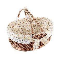 a wicker basket with flowers and lace on the handles is shown against a white background