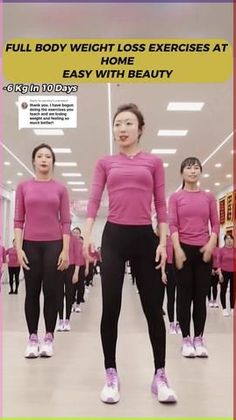 a woman in pink shirt and black pants standing next to other women wearing pink shirts