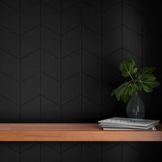 a wooden shelf with a potted plant on it