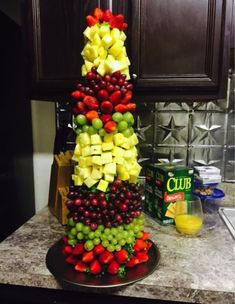 there is a very large display of fruit on the counter