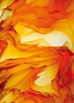 an abstract painting with orange and yellow colors on it's surface is shown in this close up photo