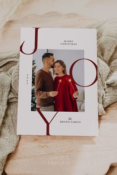 a christmas card with an image of a couple on it