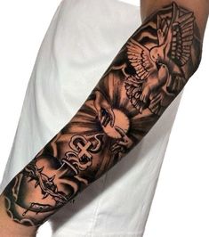 a man's arm with tattoos on it