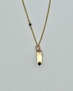 Indulge in luxury and elevate your style with our one-of-a-kind Gold Bar with Garnet Necklace. The delicate 4mm garnet cabochon adds a touch of sophistication to any outfit, making it the perfect accent piece for a chic and elegant evening. Don't miss out on this exclusive accessory, perfect for your next "little black dress" event. Black Dress Event, Dress Event, Halo Earrings, Garnet Necklace, Chic And Elegant, Outfit Making, Gold Bar, Love Necklace, Accent Pieces