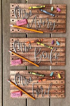 three wooden signs with writing on them and crayons attached to the boards that say happy