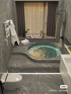 a bathroom with a large jacuzzi tub next to a toilet