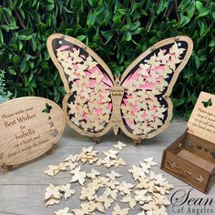 two wooden butterfly shaped plaques and some other decorations