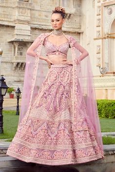 Pastel lavender pure raw silk lehenga with attached cancan and all-over floral embroidery. Comes with embroidered blouse with cups and embroidered dupatta.
Component: 3
Pattern: Embroidery
Type Of Work: Floral
Neckline: V Neck
Sleeve Type: Cap sleeves
Fabric: Lehenga and Blouse: Pure Raw Silk, Dupatta: Net
Color: Purple
Other Details: 
Floral embroidery
Note: The neckpiece worn by the model is not for sale
Occasion: Bride,Wedding - Aza Fashions Luxury Purple Floral Embroidered Lehenga, Lavender Bridal Lehenga, Lavender Care, Lehenga With Blouse, Purple Lehenga, White Lehenga, Raw Silk Lehenga, Pastel Lavender, Wedding Sari