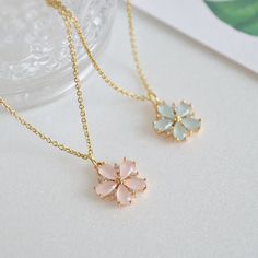 Dainty Custom Cherry Blossom necklace in gold. ♥ You can buy the matching earrings from following link. https://www.etsy.com/listing/1493723272 https://www.etsy.com/listing/167001667 ♥ Material - 18K gold plated over brass, Glass stone, Zircon ♥ The chain length - 14 ~ 20 inches (adjustable chain) ♥ Measurement - 13mm ♥ All the jewelry comes with gift wrap ♥ Please check the shop policy before you buy the products. Cute Flower Shaped Jewelry For Mother's Day, Delicate Flower Shaped Necklace For Bridesmaid Gift, Cute Rose Gold Flower Jewelry, Cute Rose Gold Flower-shaped Jewelry, Cute Gold Flower-shaped Jewelry, Delicate Flower Shaped Jewelry For Bridesmaid Gift, Dainty Flower-shaped Jewelry For Bridesmaids, Feminine Petal-shaped Jewelry Gift, Feminine Gold Petal Jewelry