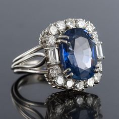 an oval blue sapphire and diamond ring