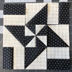 the block is made up of black and white fabric, which has been stitched together