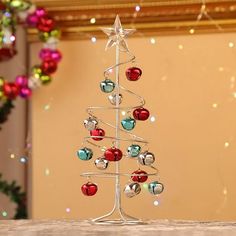 a small christmas tree with ornaments on it